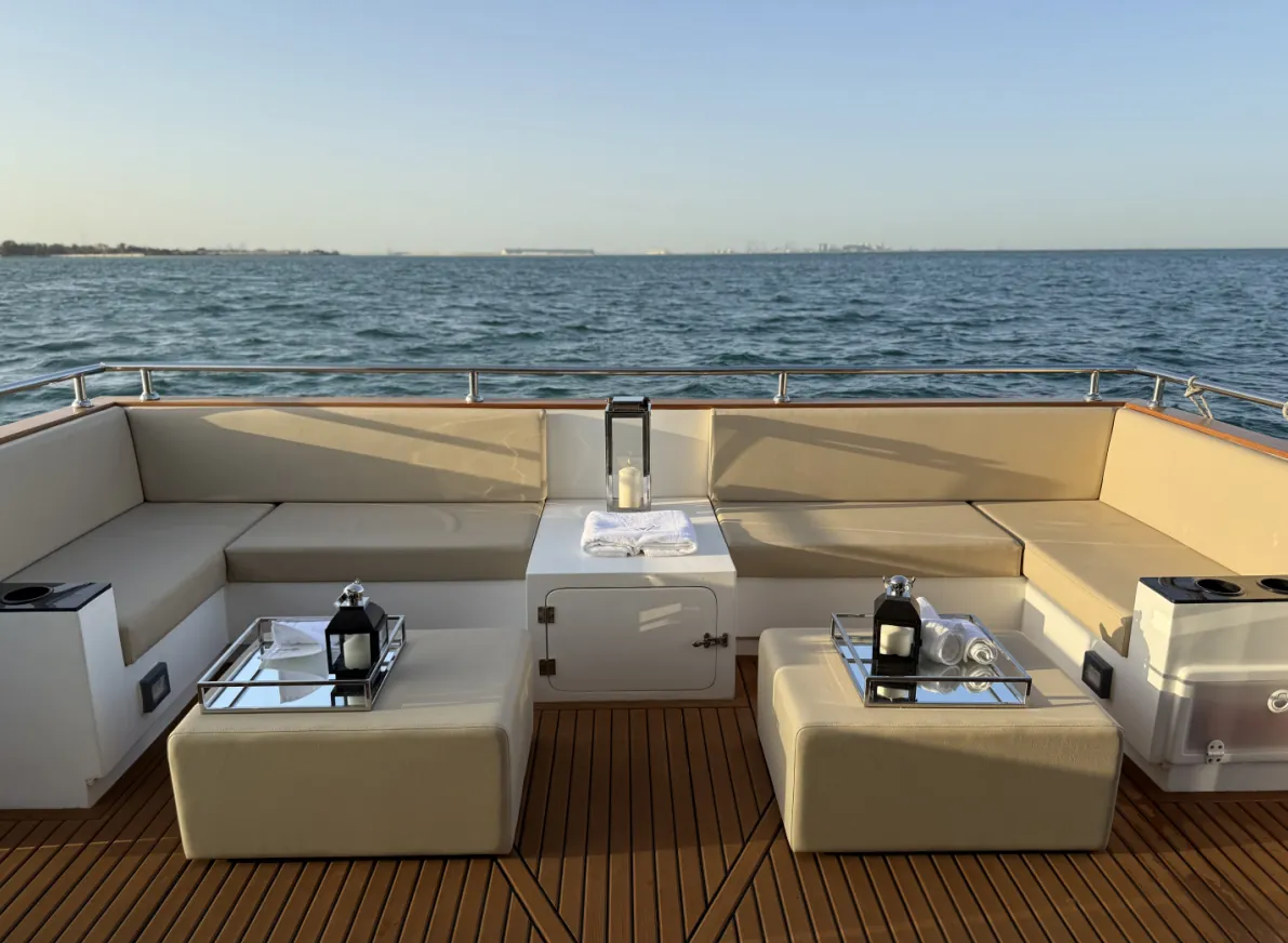 Aquator 28 bow lounge with U-shaped seating and teak deck