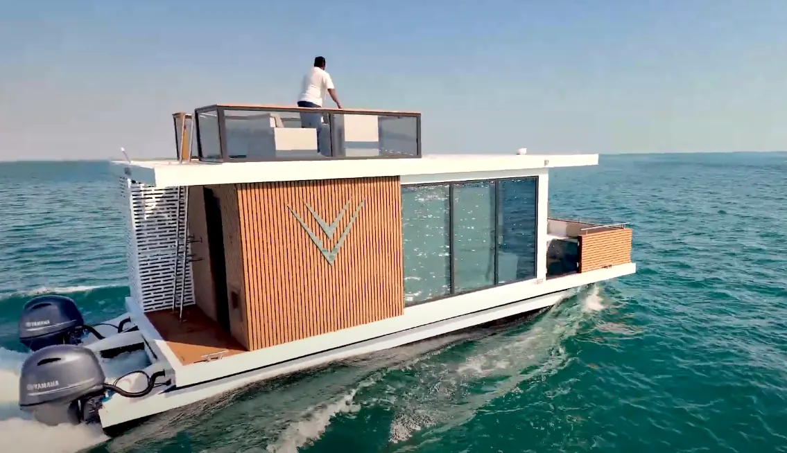 Aquator 28 cruising with a guest on the top deck