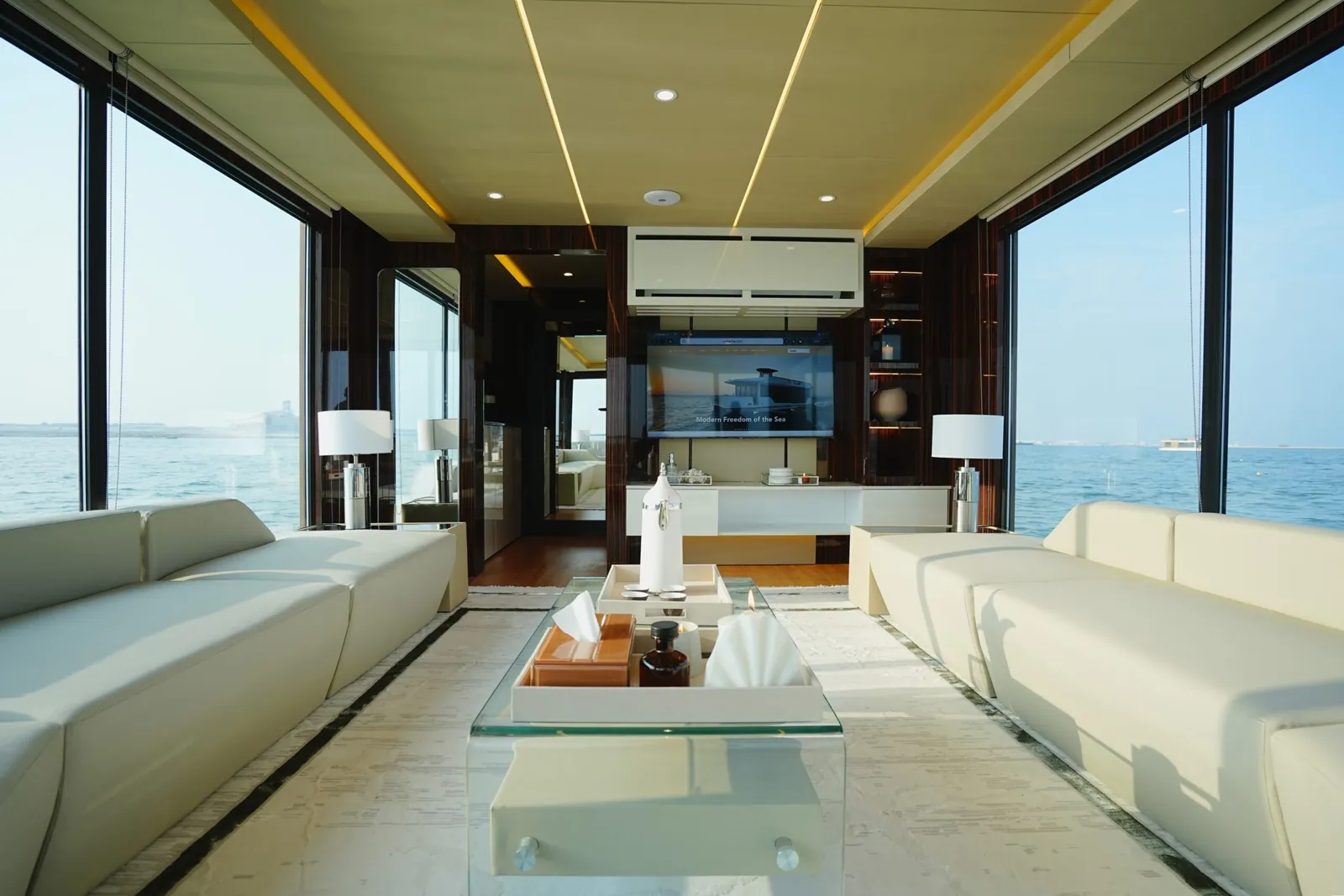 Aquator saloon with facing sofas and floor-to-ceiling glass
