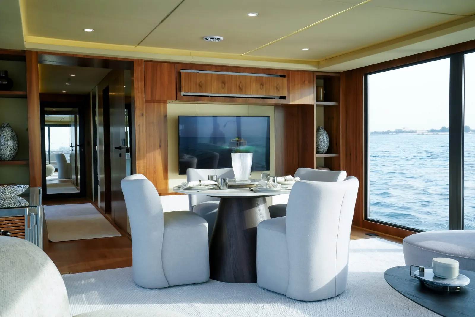 Aquator 42 dining table set beneath a timber feature wall