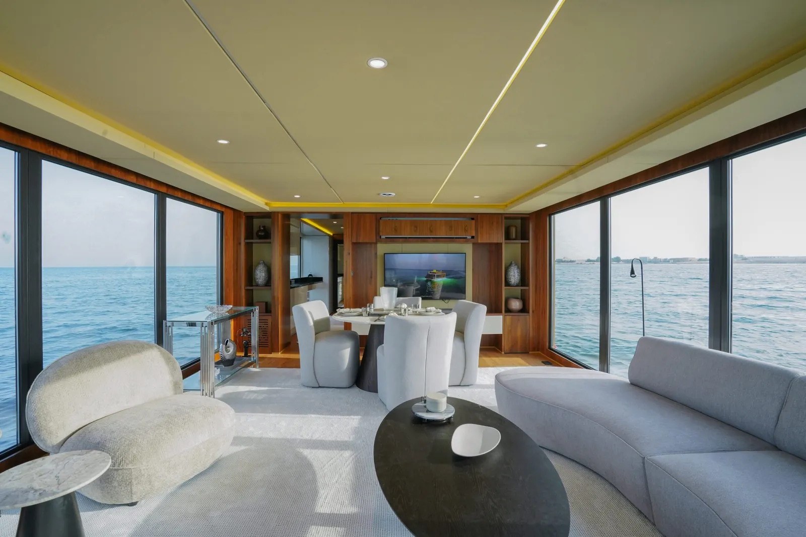 Aquator 42 living room with curved sofas and an oval coffee table