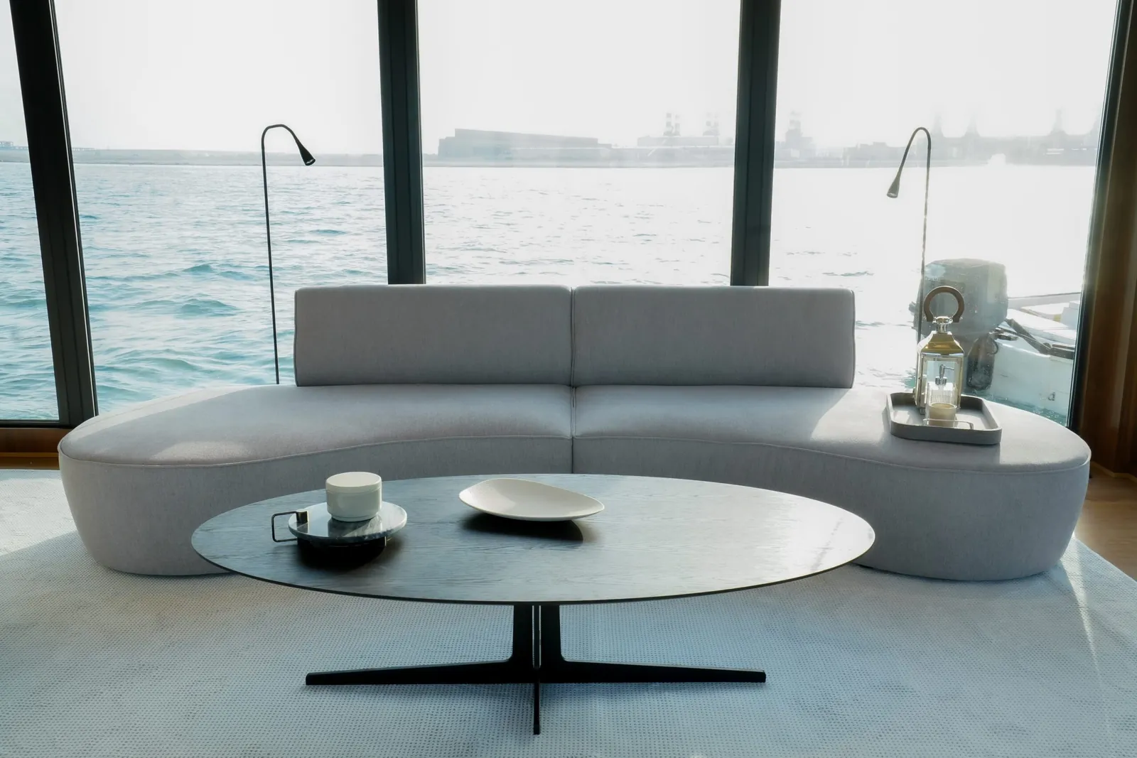 Aquator 42 curved sofa facing the panoramic windows