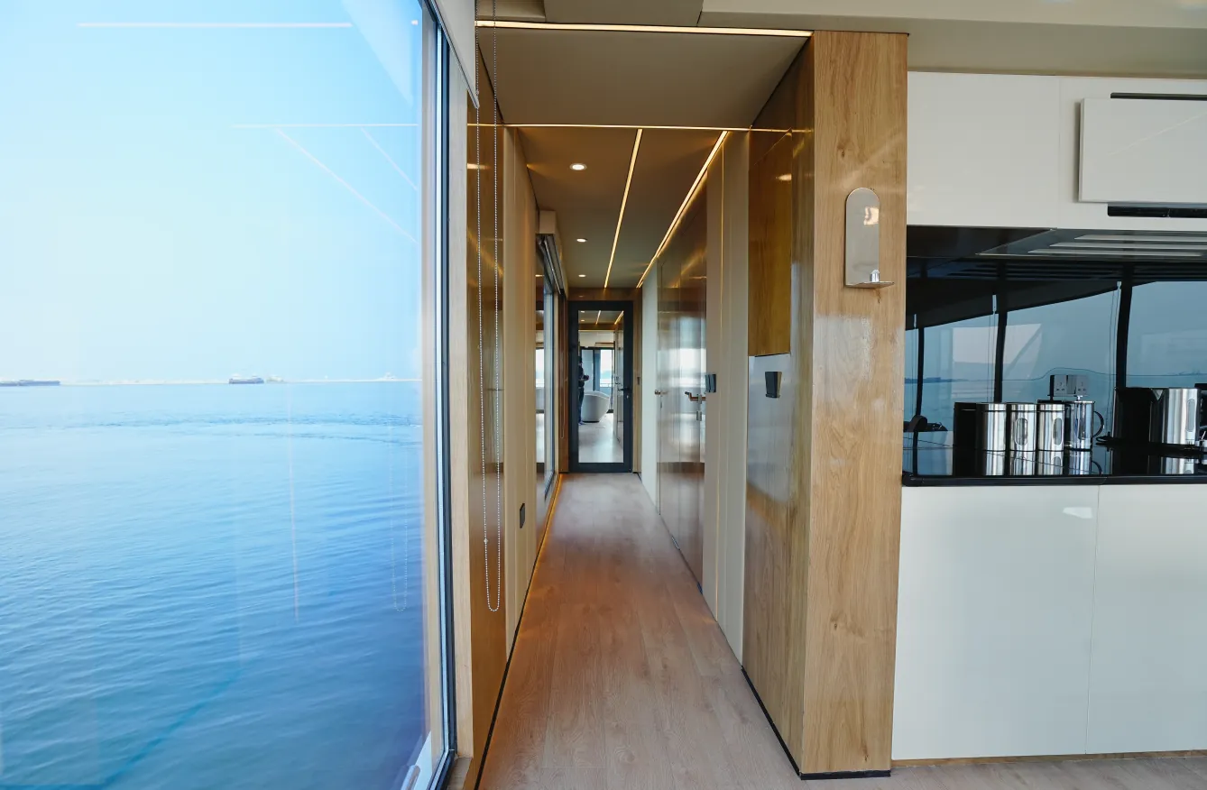 Aquator 50 galley corridor with timber joinery and sea views