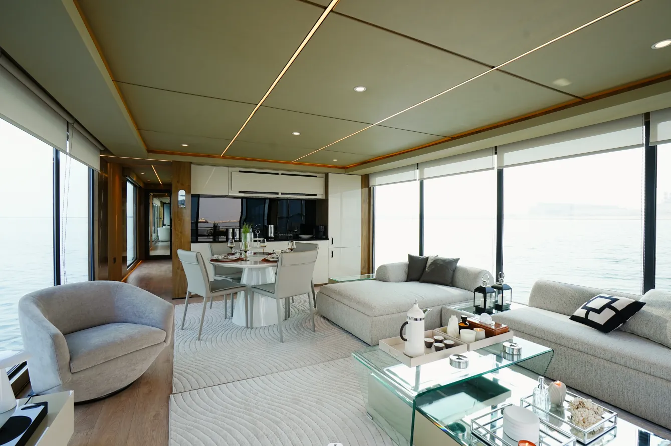 Aquator 50 living room with lounge chairs and dining table