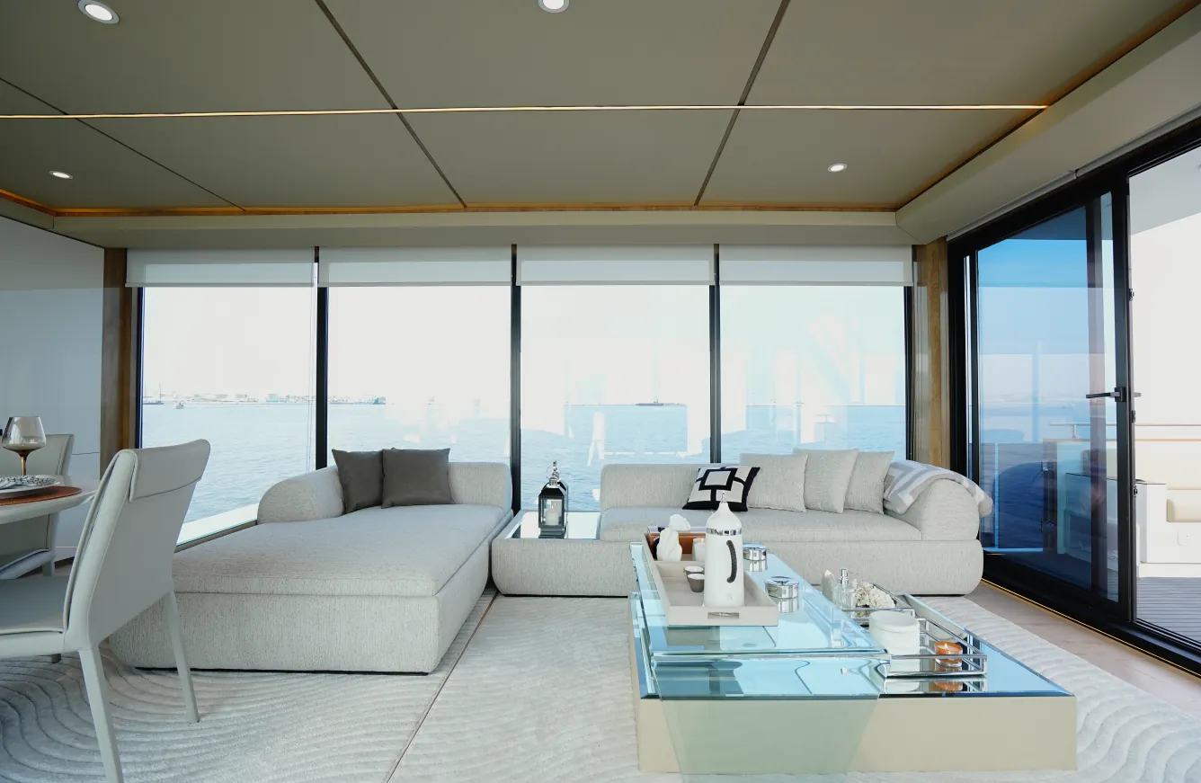 Aquator 50 saloon with a corner sofa facing full-width glazing