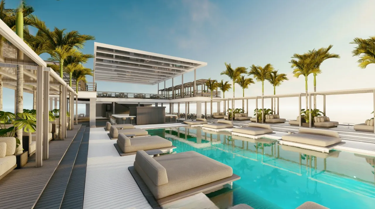 Floating beach club with a long pool, palms and daybeds