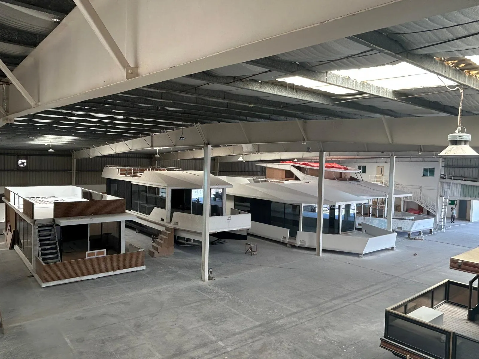 Several HotelYacht hulls side by side in the V-Marine assembly hall