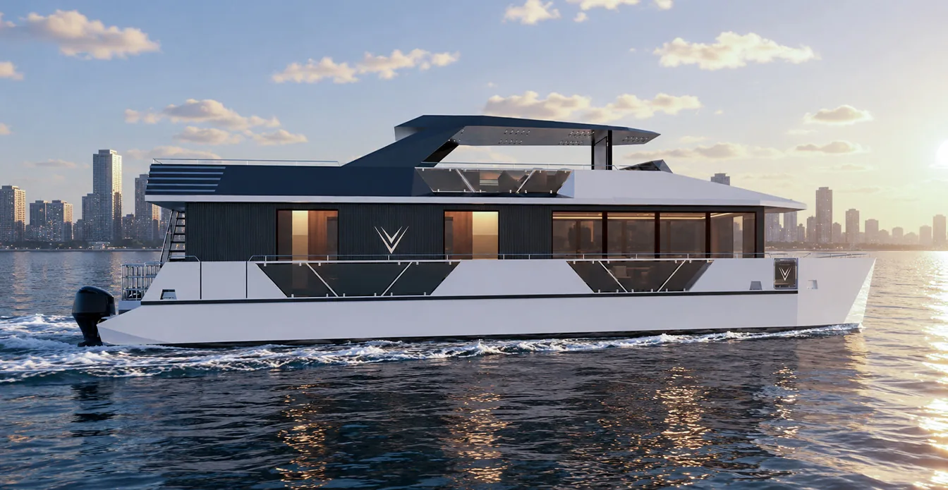 RISE 70 catamaran in profile, cruising past a city skyline at sunset