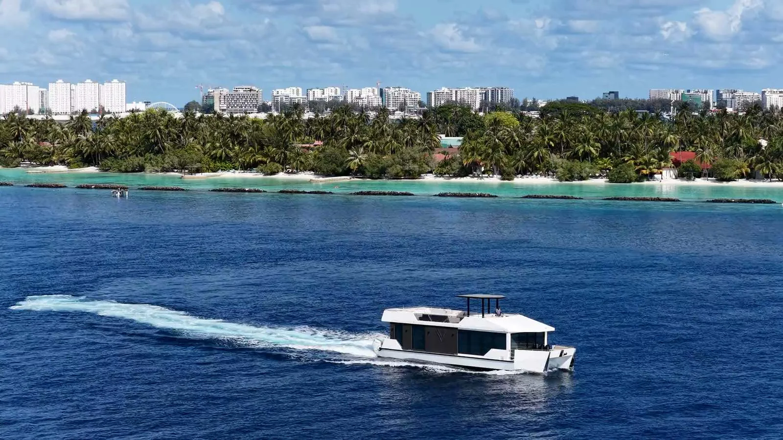 RISE 60 Classic cruising past a Maldives island